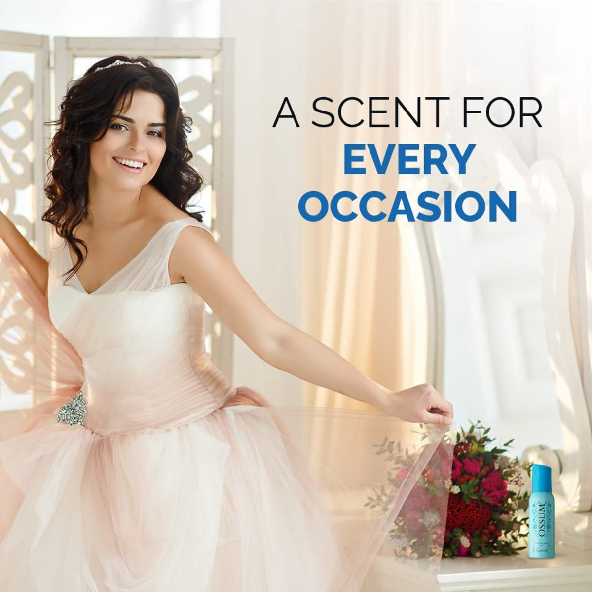 Woman in a white dress holding a sheer fabric with a bottle of cherish perfume and flowers on a table.